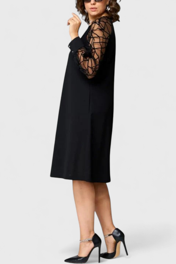 Bellezza Vestido Negro con Mangas de Malla y Corte Holgado